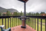 Private balcony with gas grill and mountain views. 